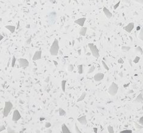 Close-up of white terrazzo surface with irregular scattered gray and black stone chips.