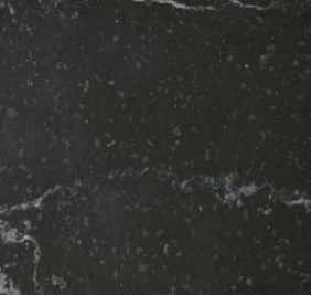 Close-up view of a black marble surface with white veining and subtle texture.