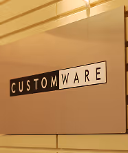 CustomWare logo on wall KL Office Launch 2005