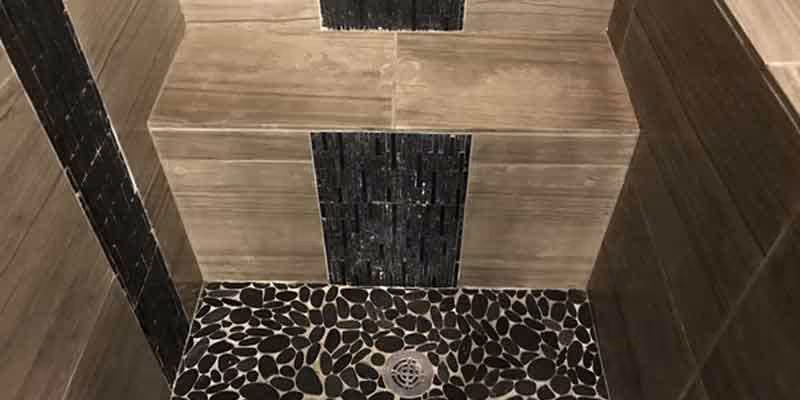 travertine and marble shower after deep cleaning and honing