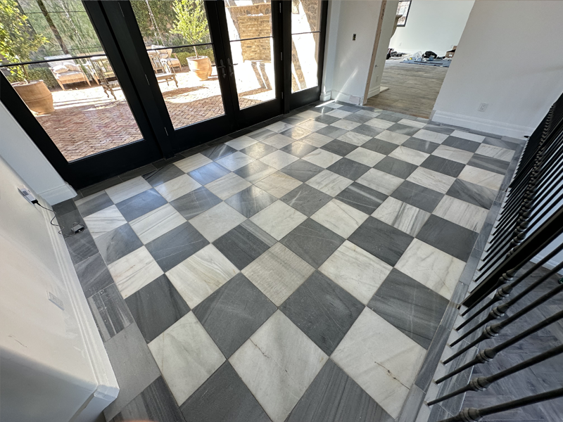 Surface wear and scratches on marble floor before refinishing