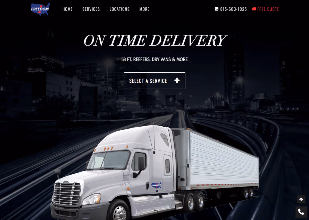 White semi-truck with trailer on a highway at night with city buildings in the background.