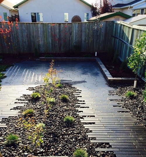 landscaping in backyard with navaro paving stone Winnipeg