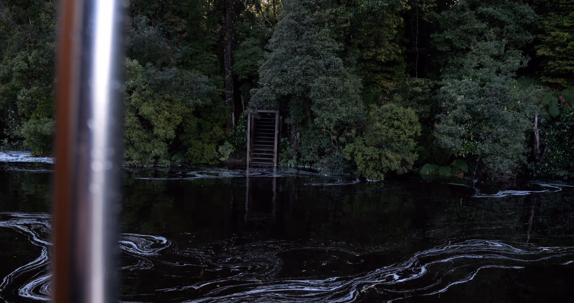 wooden stairs at lovers falls surrounded by trees