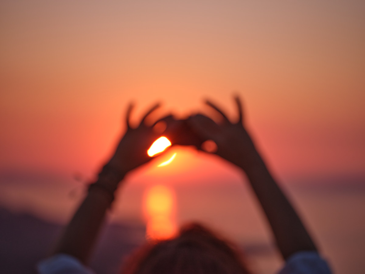 The blurry outlines of a stone being held into the sun