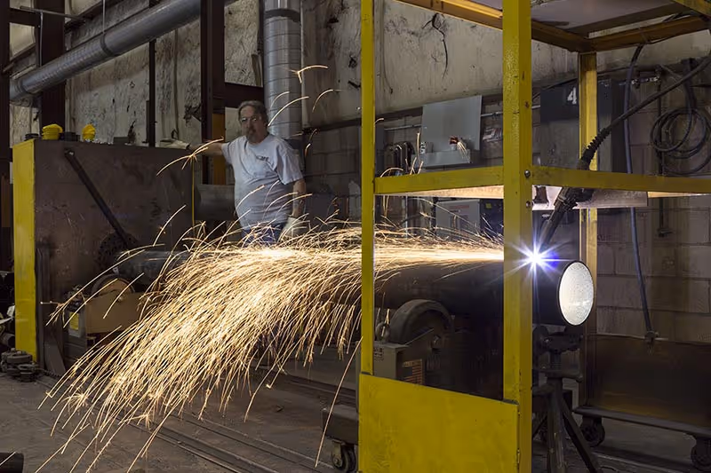 sparks flying during piping fabrication in M&E's Richmond-based multi-million dollar, state-of-the-art fabrication center - electrical fabrication