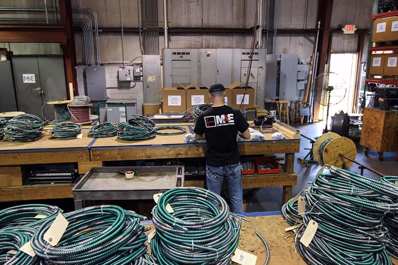 An employee working on electrical prefab in M&E's Richmond-based multi-million dollar, state-of-the-art fabrication center