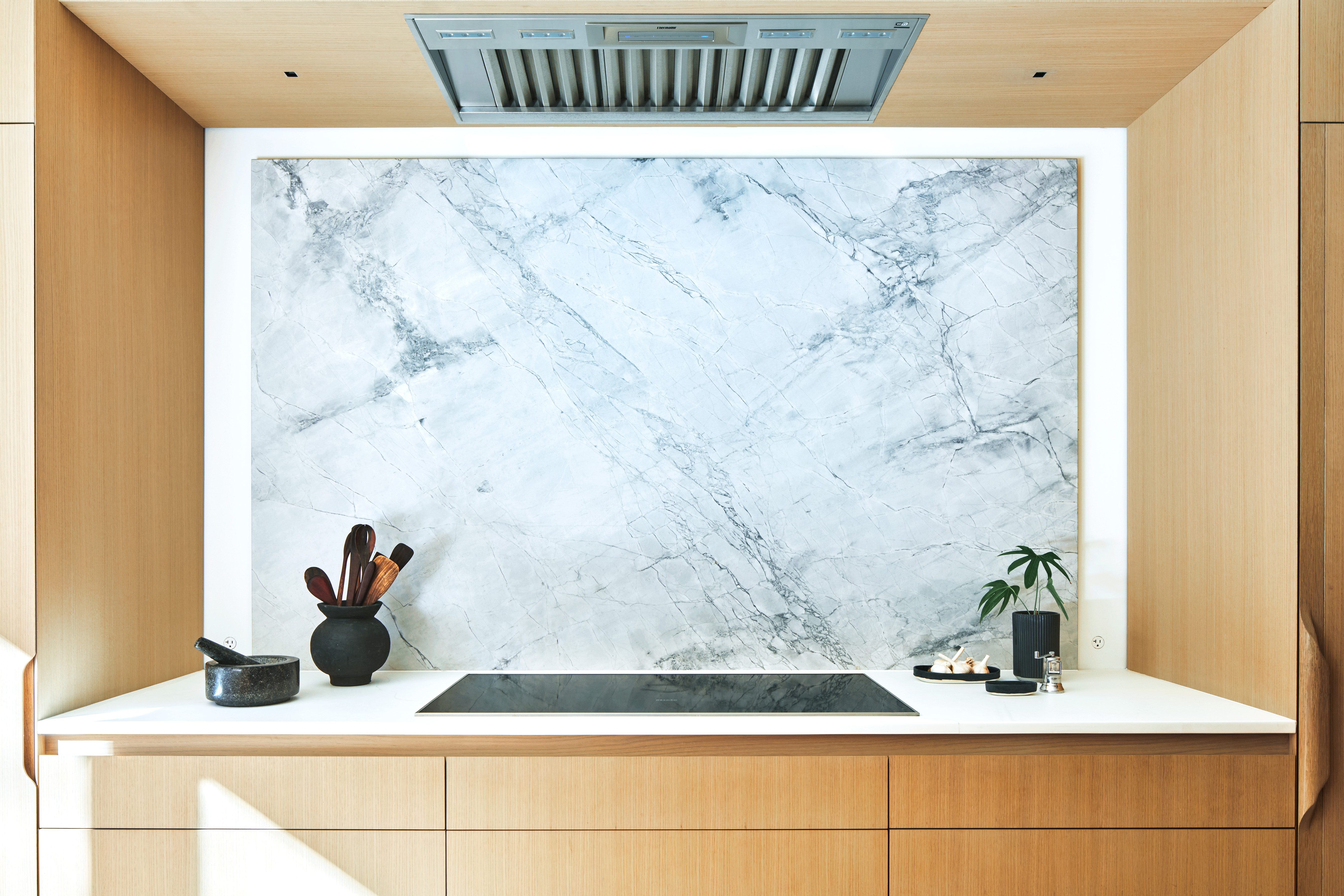 marble back splash, induction cook top, georgous kitchen
