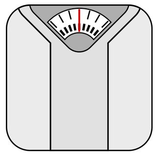 Analog bathroom scale with a red needle pointing to zero.