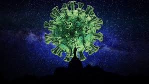 Green 3D coronavirus model superimposed over a silhouette of a person against a starry night sky.
