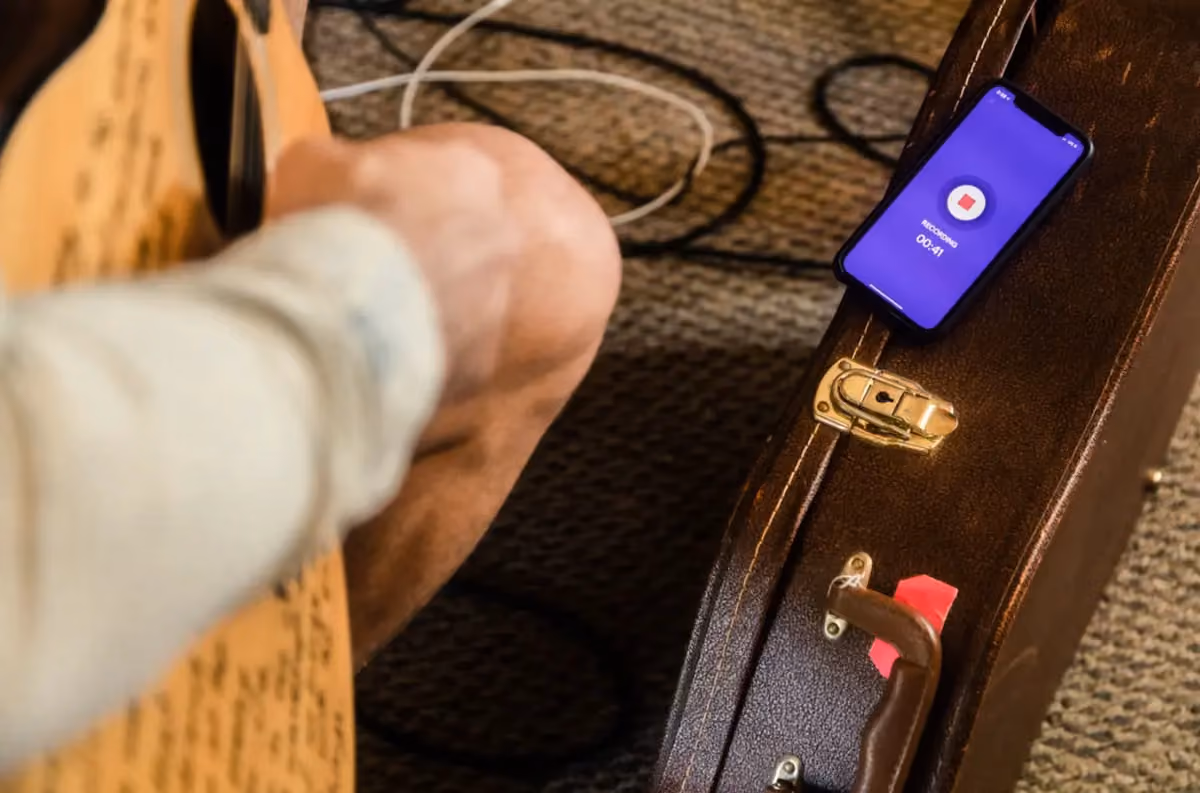 musician recording into their phone