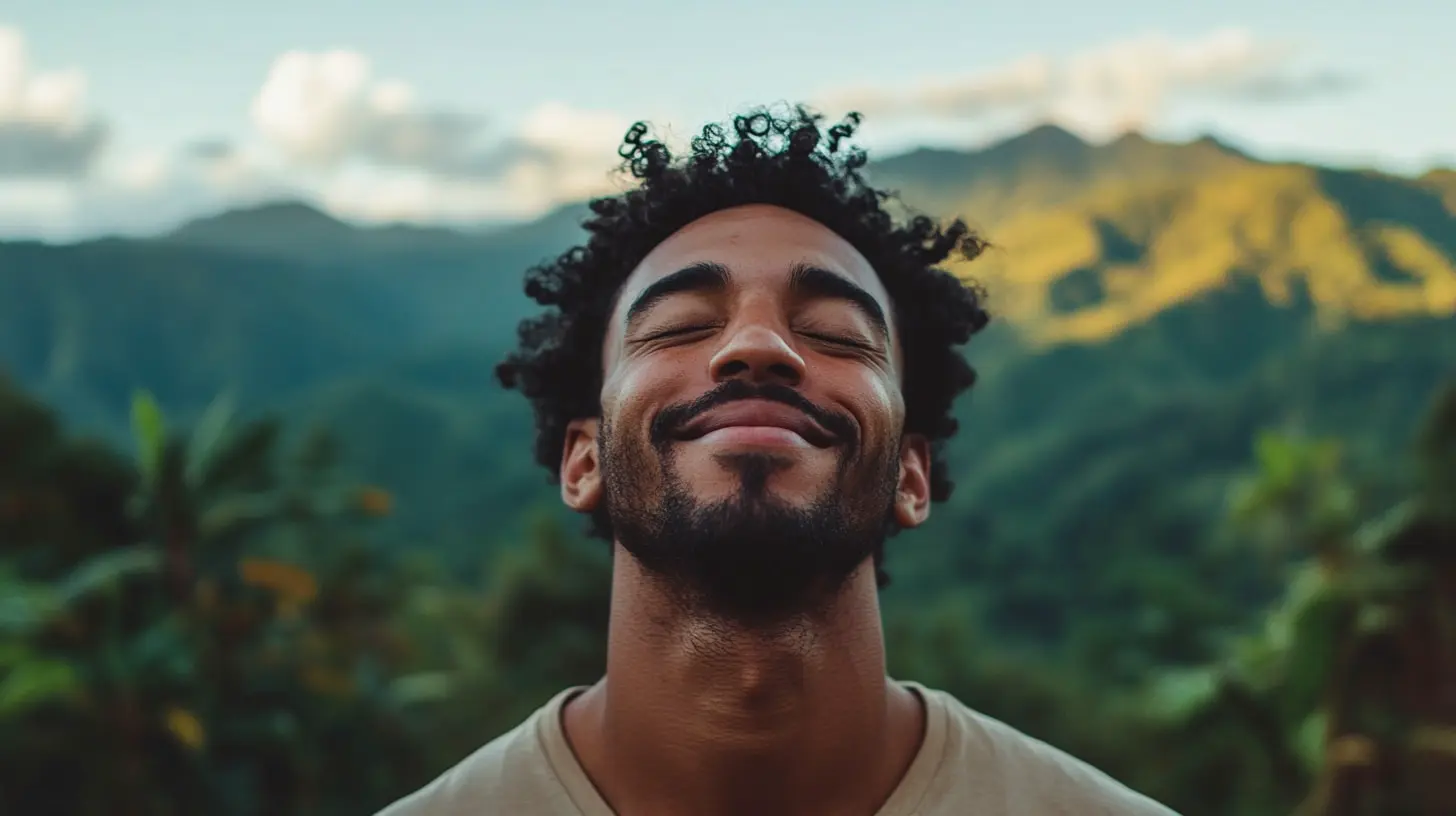 A man smiled while closing his eyes, with a backdrop of tropical forests and mountains