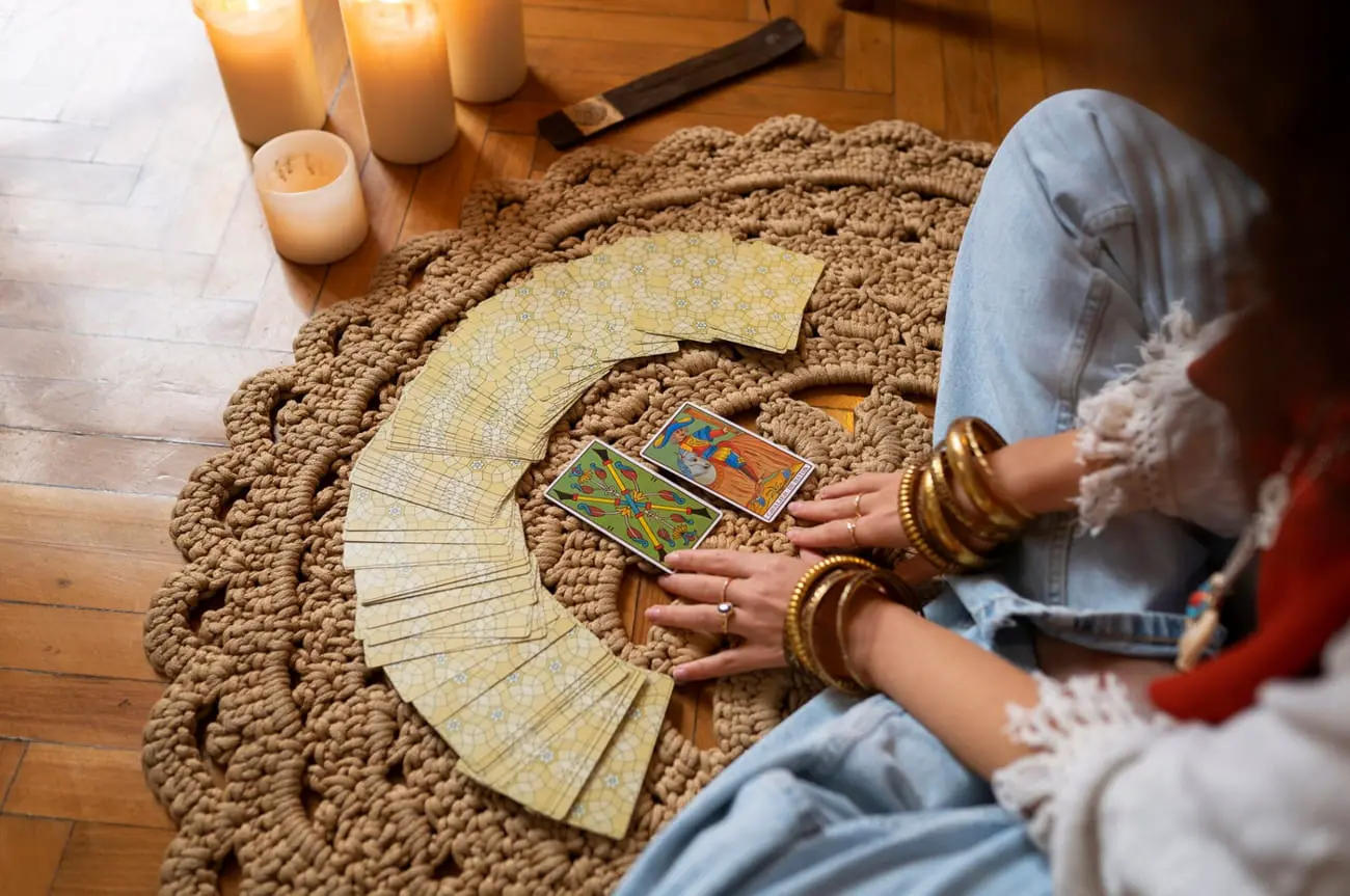 High angle woman reading tarot at home