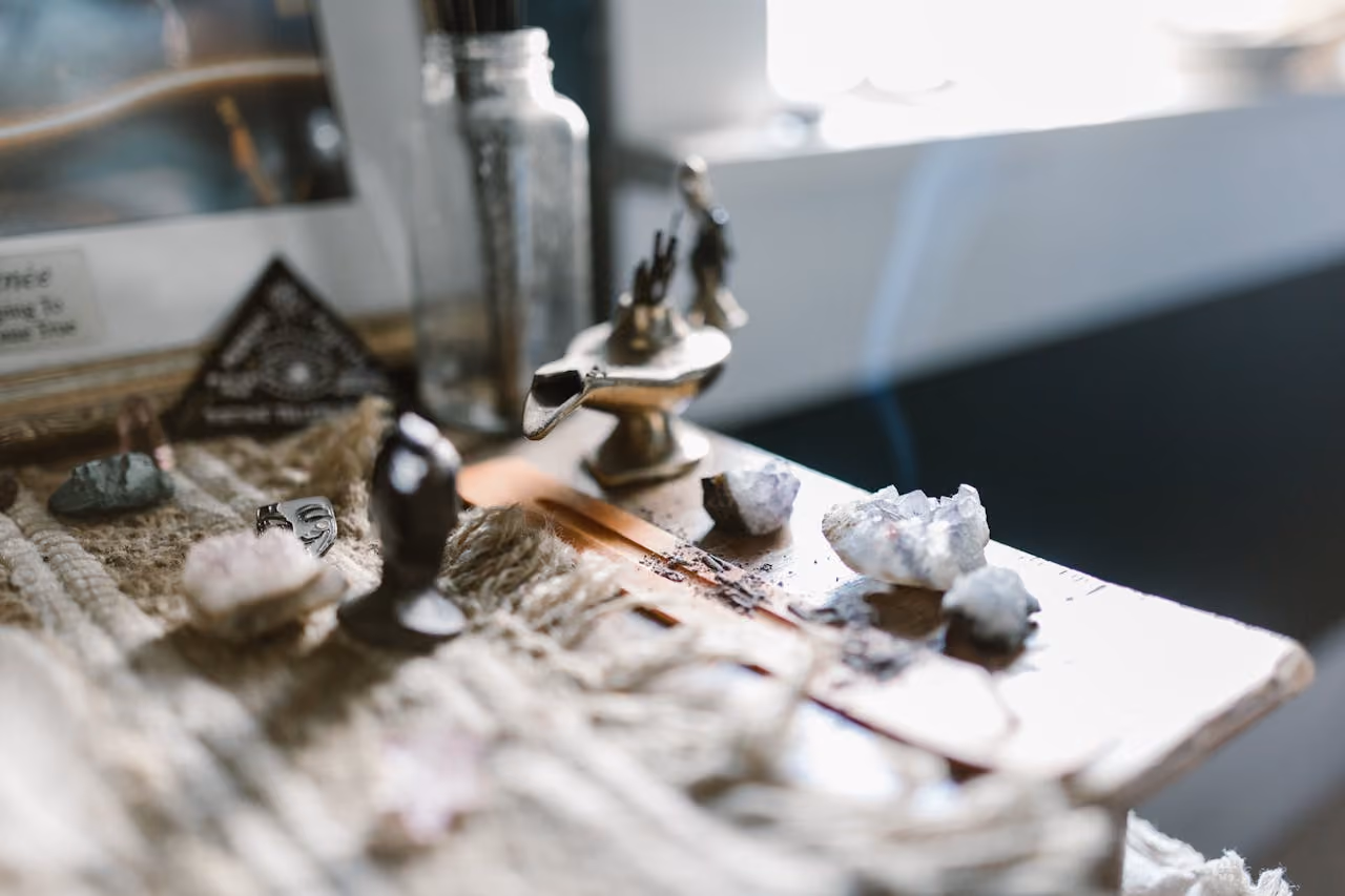 crystals and incense on a sunlit altar