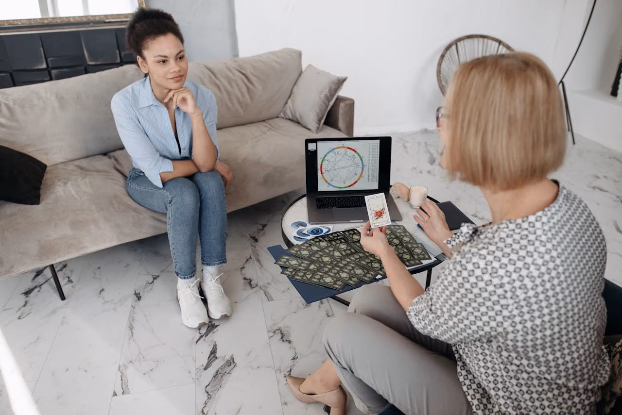 woman reviewing her chart with a professional astrologer