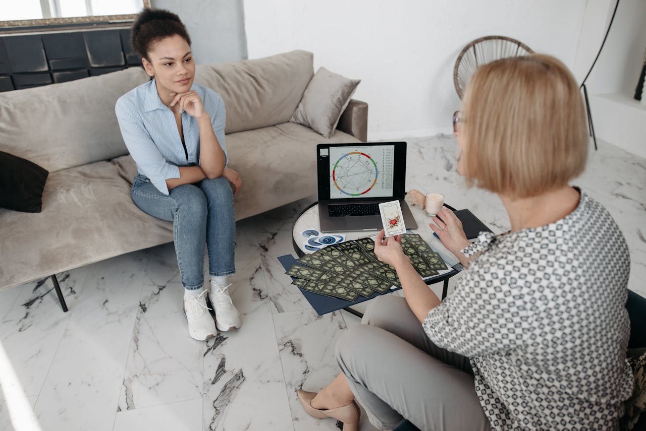 woman reviewing her chart with a professional astrologer