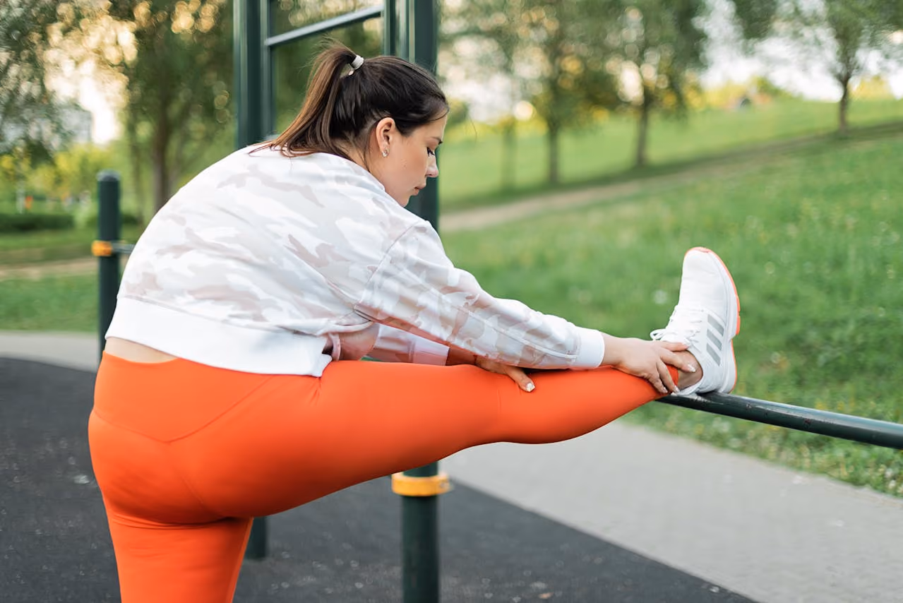 woman in running gear stretching after a workout