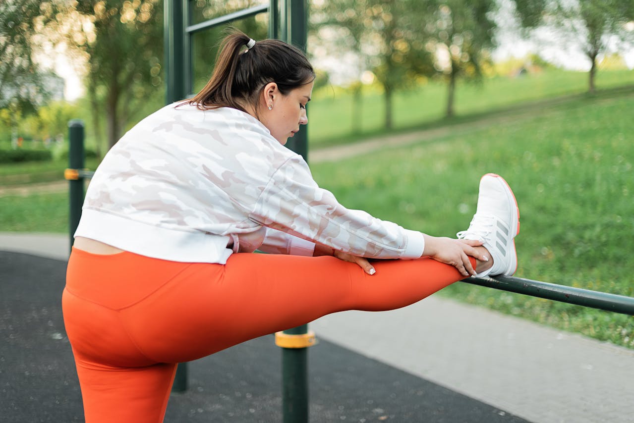 woman in running gear stretching after a workout