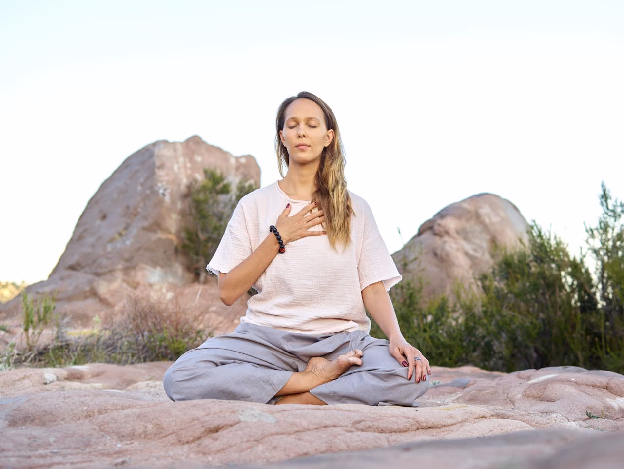 spiritual woman meditating in the desert