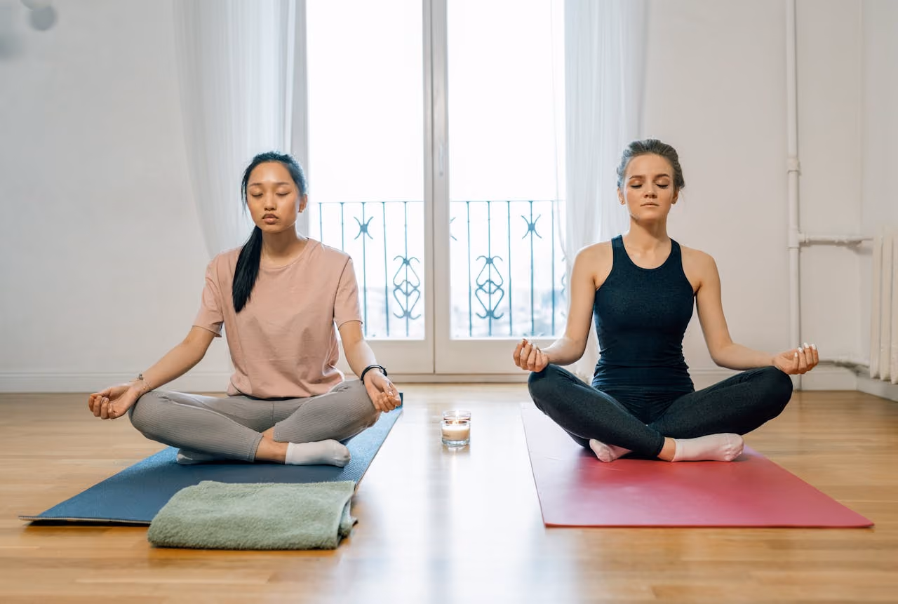 two women meditate for spiritual and physical wellness