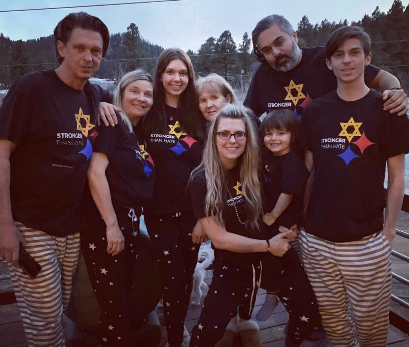 Activist Kellee Maize and her family pose in Pittsburgh-themed t-shirts that read Love Is Stronger Than Hate