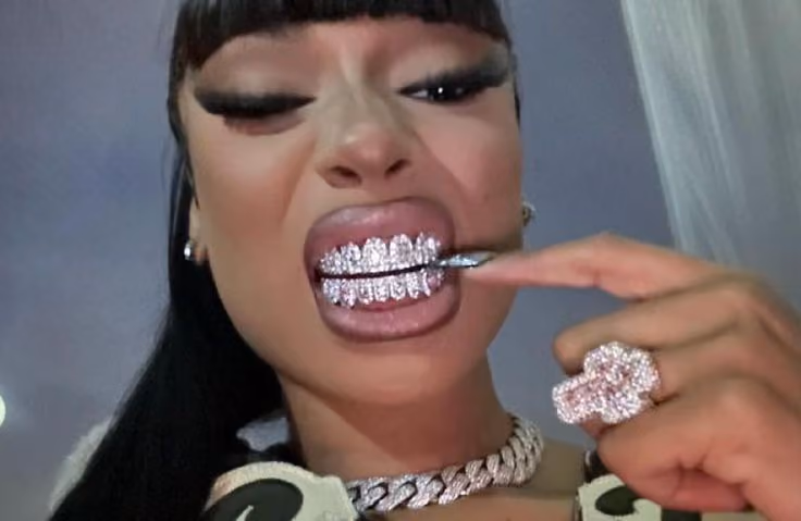 Megan Thee Stallion shows off her diamond grill