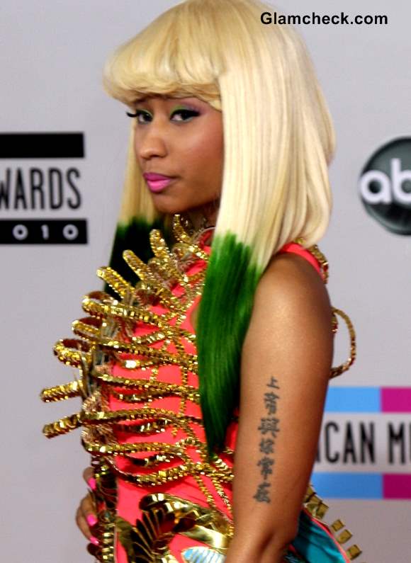 Nicki Minaj on the red carpt, her arm tattoo visible