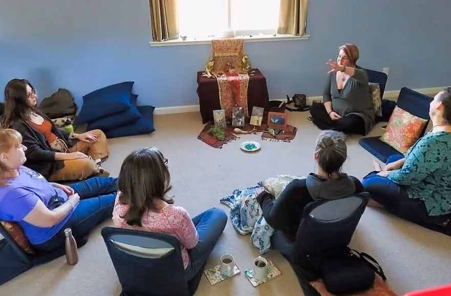 group of women seated together in a spiritual circle