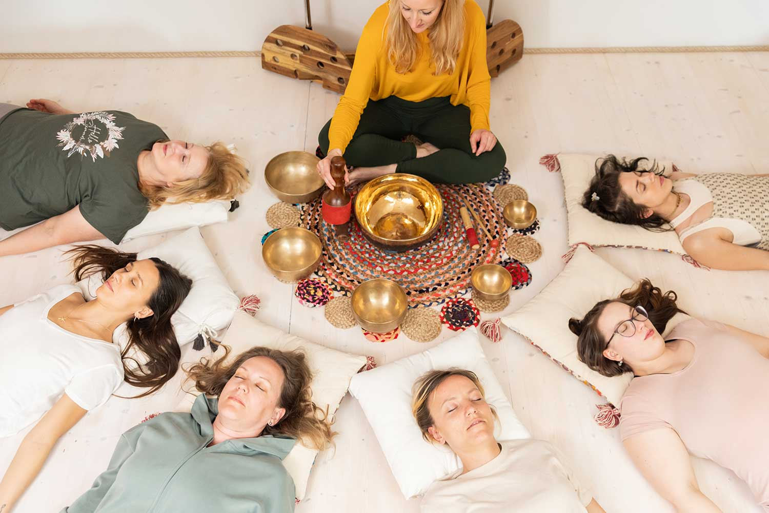 group of women doing a sound bath