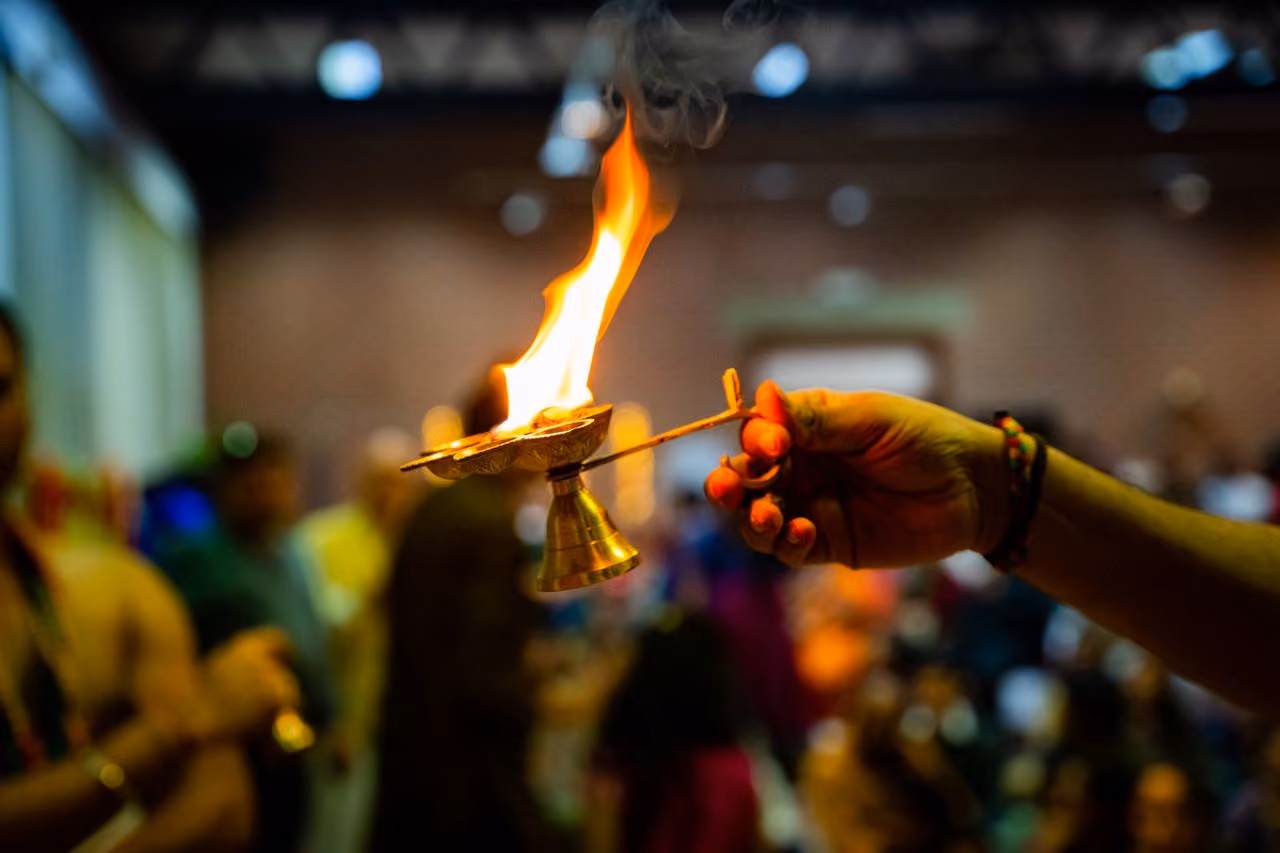 fire in a metal vessel being used in a spiritual ceremony