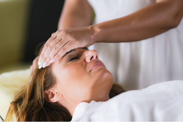 woman having a reiki session