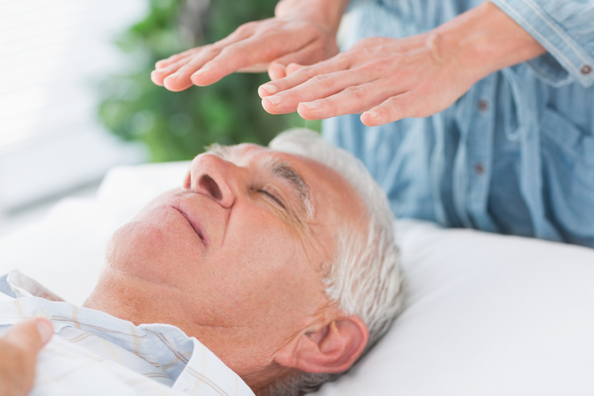 older man receiving reiki
