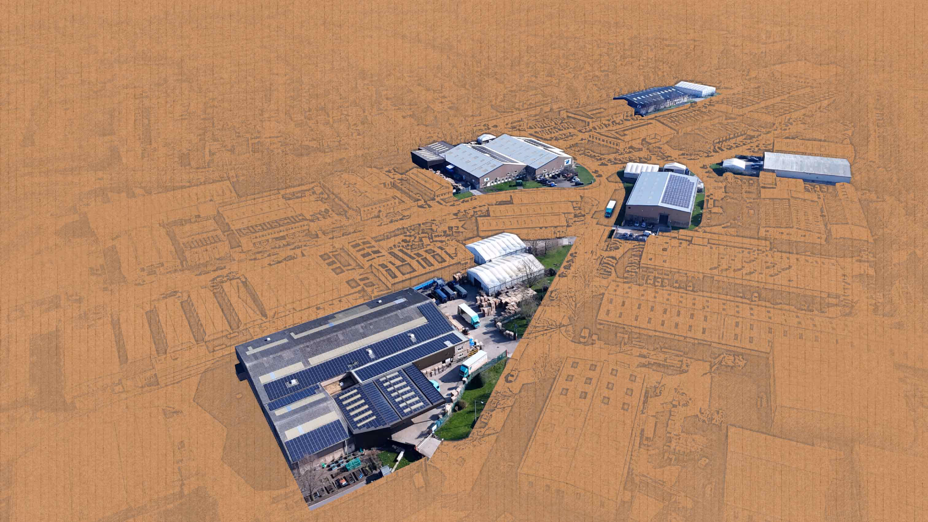 Aerial view of five industrial buildings with solar panels on roofs surrounded by a sketch on cardboard.