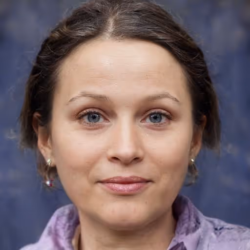 Woman with light skin, blue eyes, and brown hair pulled back, wearing light makeup and a lavender scarf.