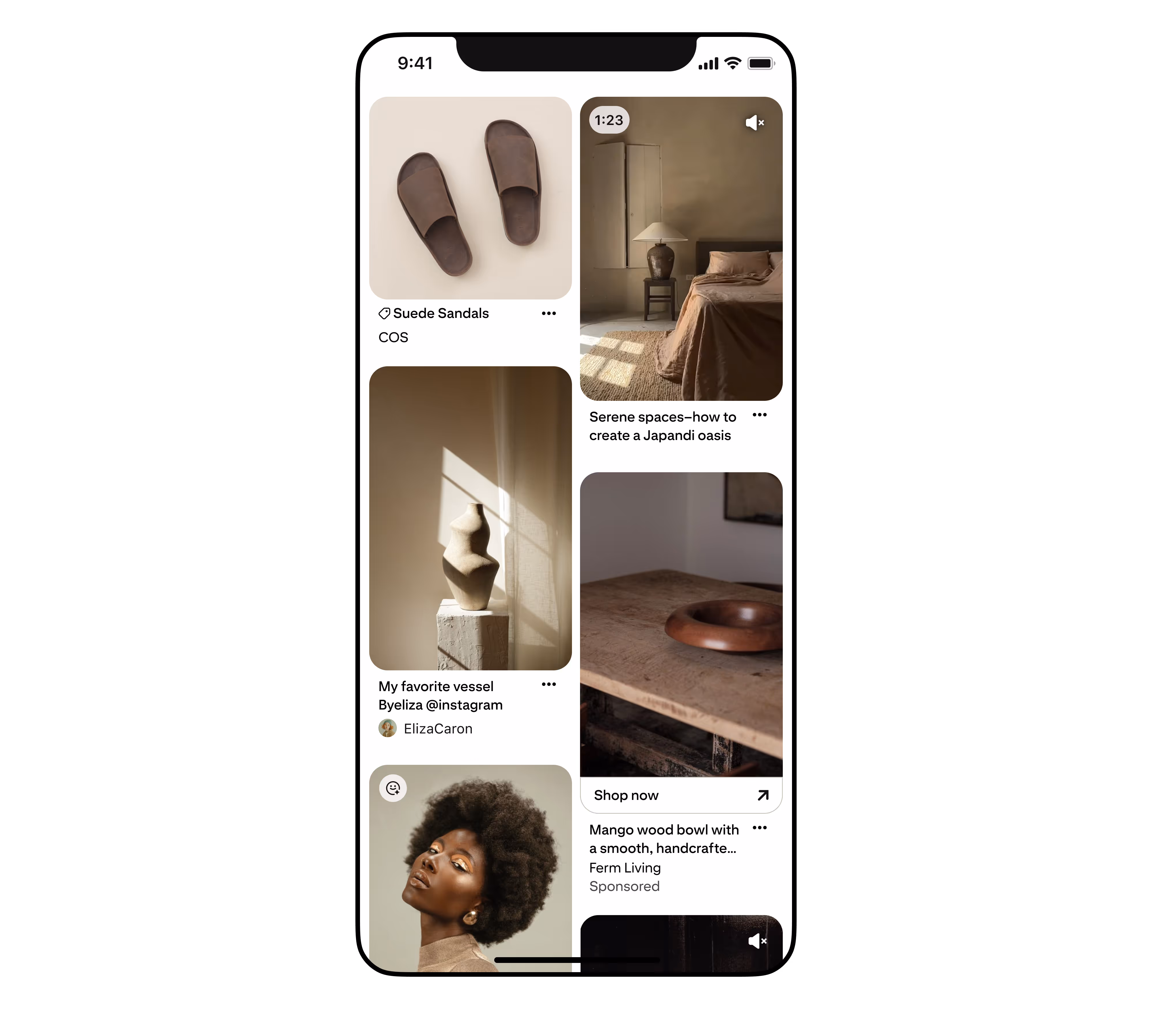 Smartphone screen showing a Pinterest-like app with images of suede sandals, a bedroom with Japandi decor, a sculpted vessel, a mango wood bowl, and a portrait of a woman with an afro hairstyle.