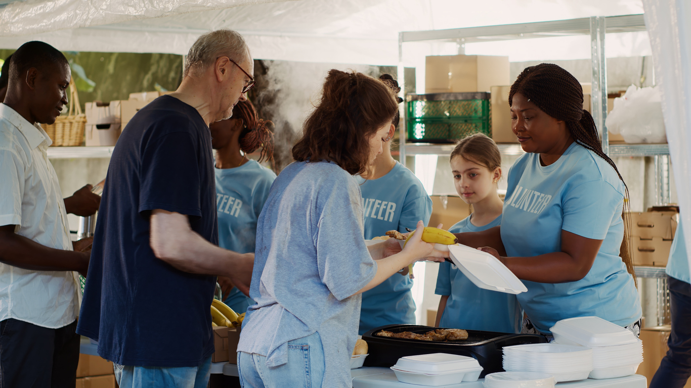Diverse volunteers helping at a community food drive