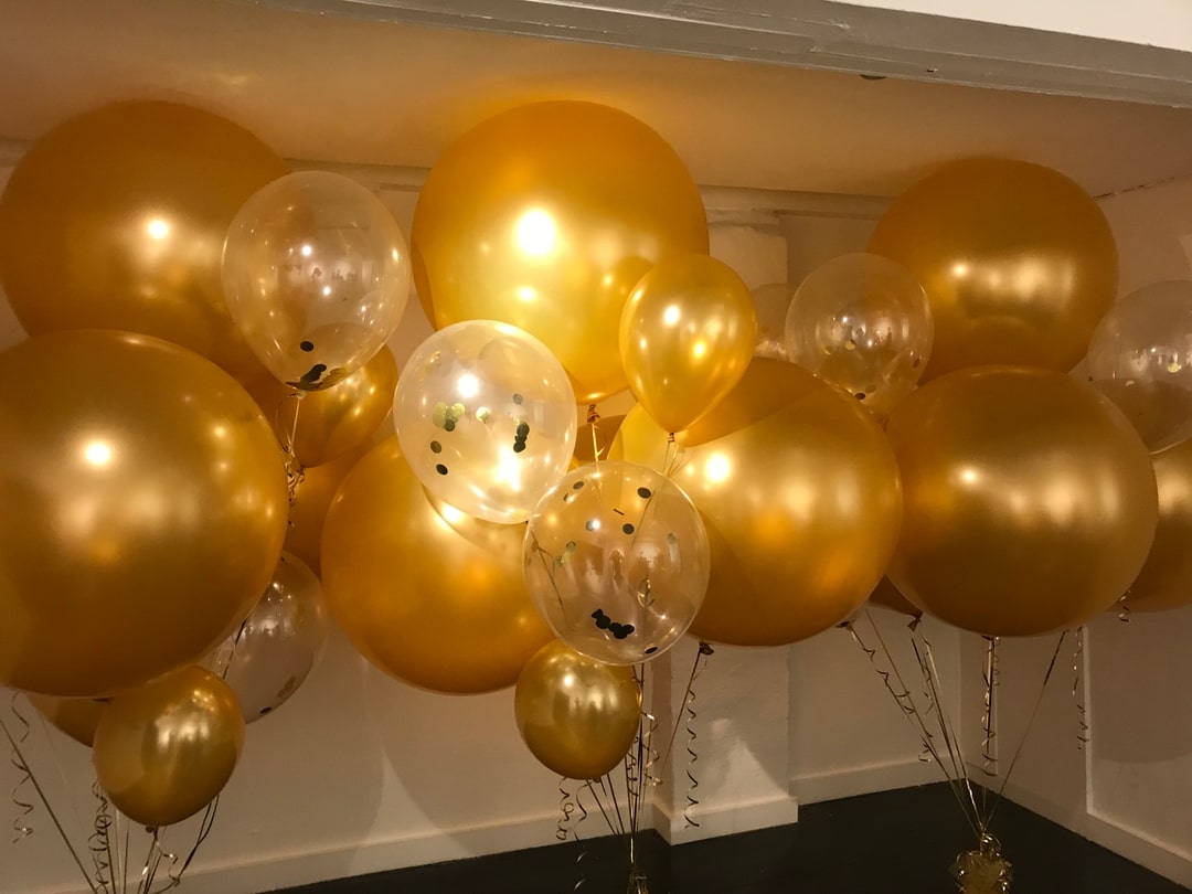 Large gold balloons designed for a fashion launch
