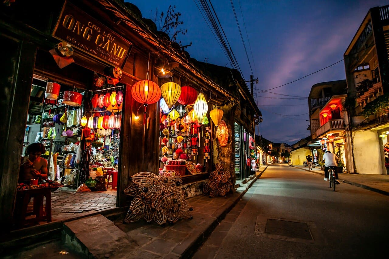 Colorful lantern shop lighting the streets of Hoi An Ancient Town at night, one of Vietnam's most charming UNESCO destinations.