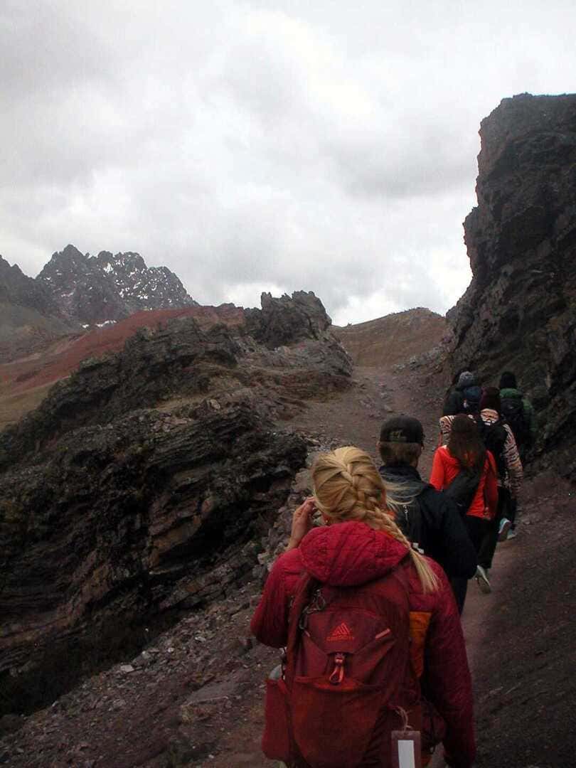 Hiker on a mountain trail in the Peruvian Andes