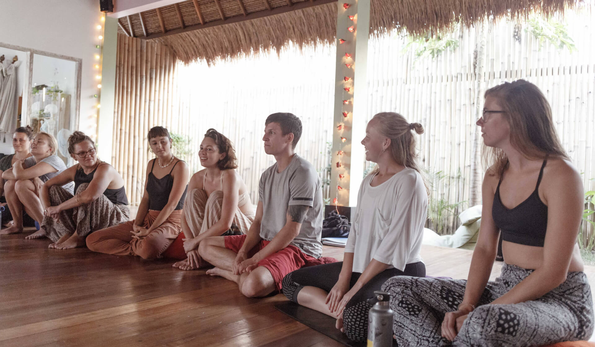 A group of yoga students in a sharing circle at a Nomad Yoga 200 hour yoga teacher training