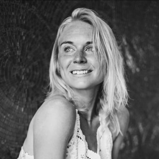 Close up black and white headshot of a woman smiling