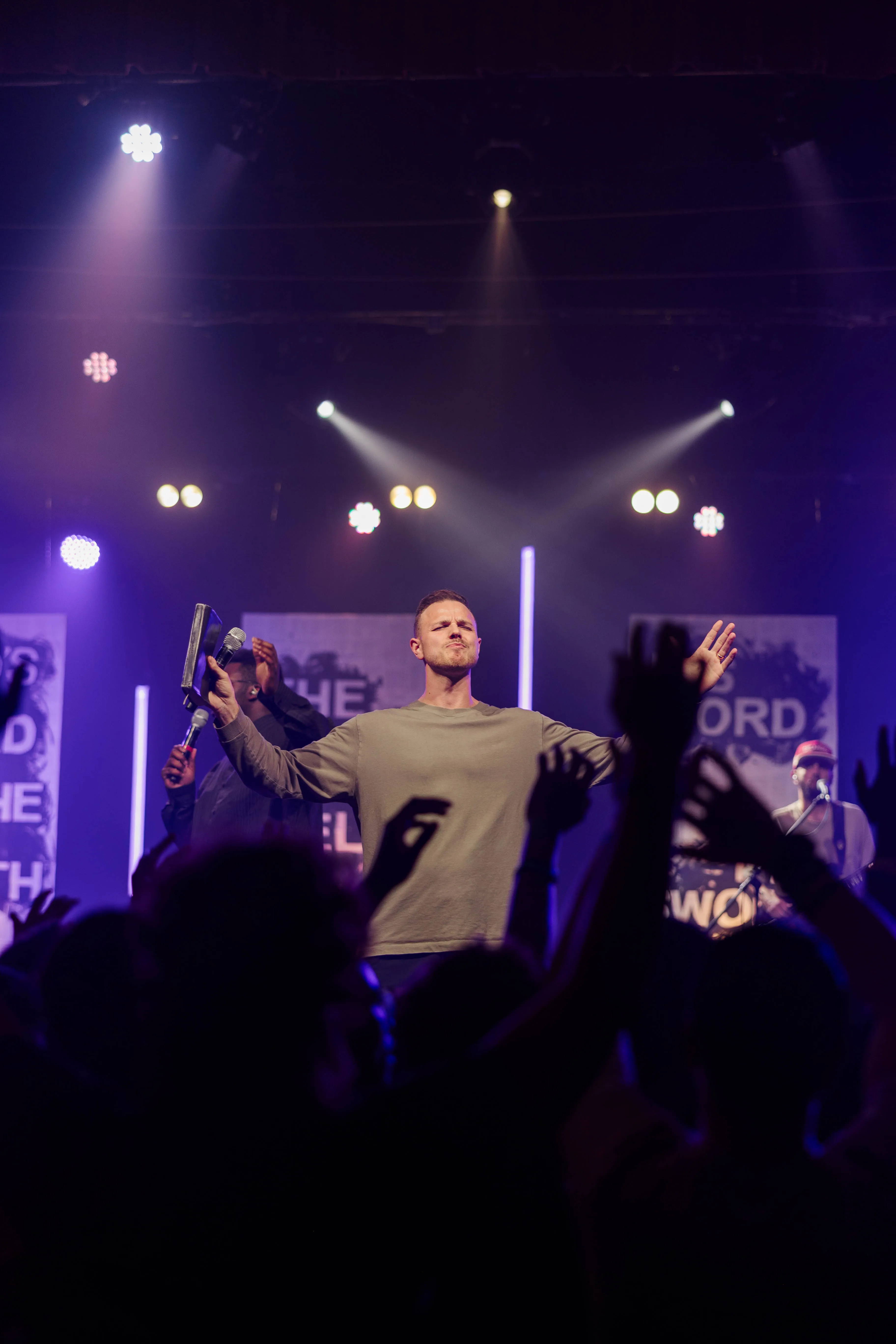 Students responding in worship during CrossWalk Youth Conference 2025.
