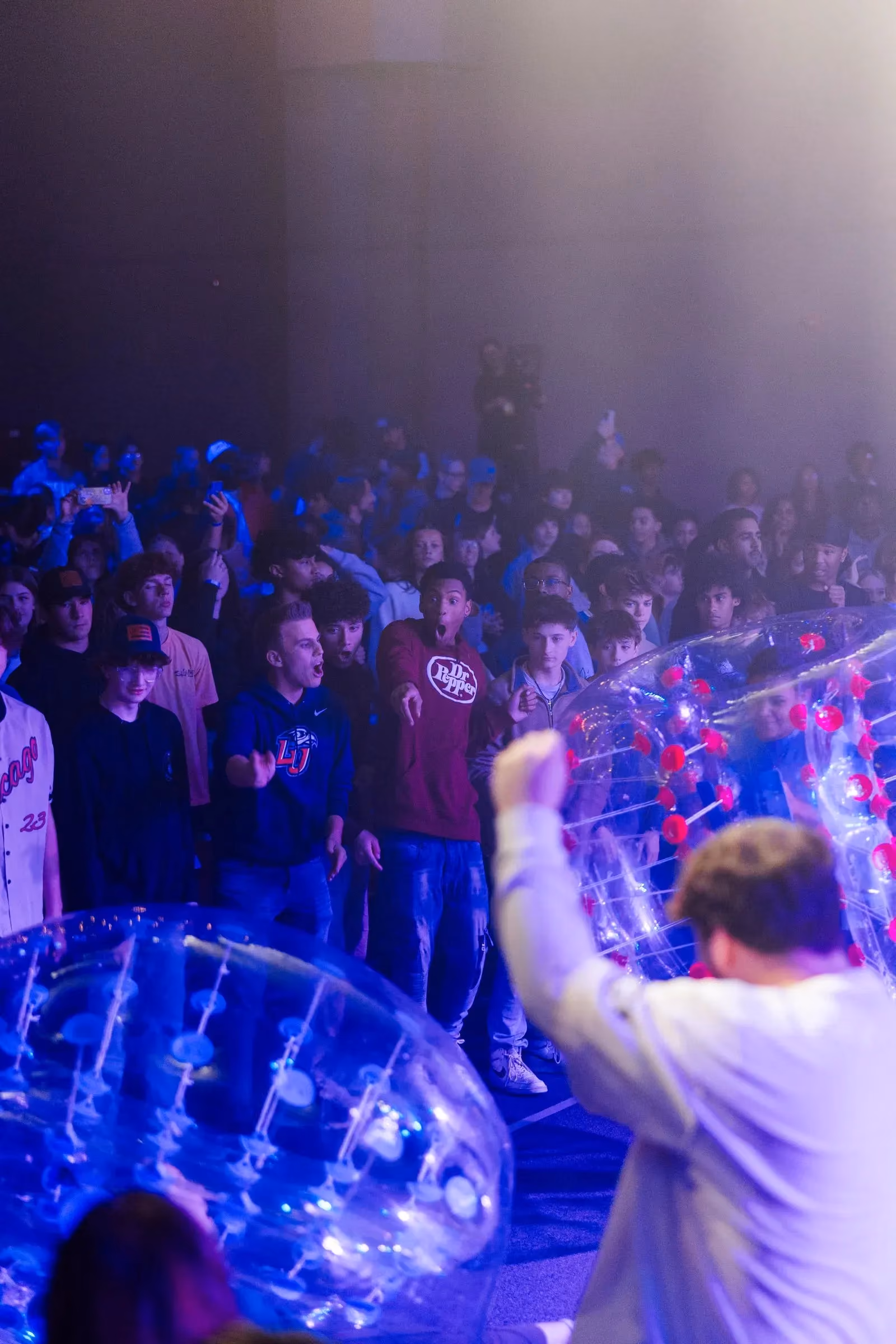 Students cheering during a late-night activity at CrossWalk Youth Conference 2025.