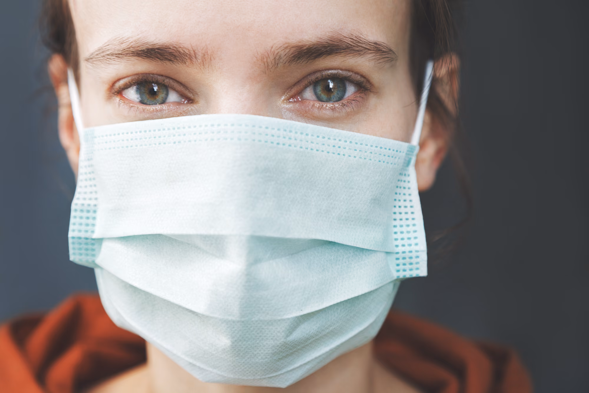 Close up of a woman wearing a mask