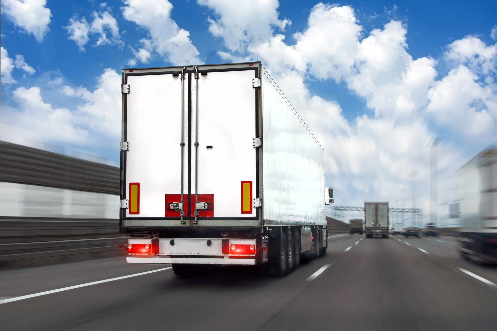 A truck drives on the highway