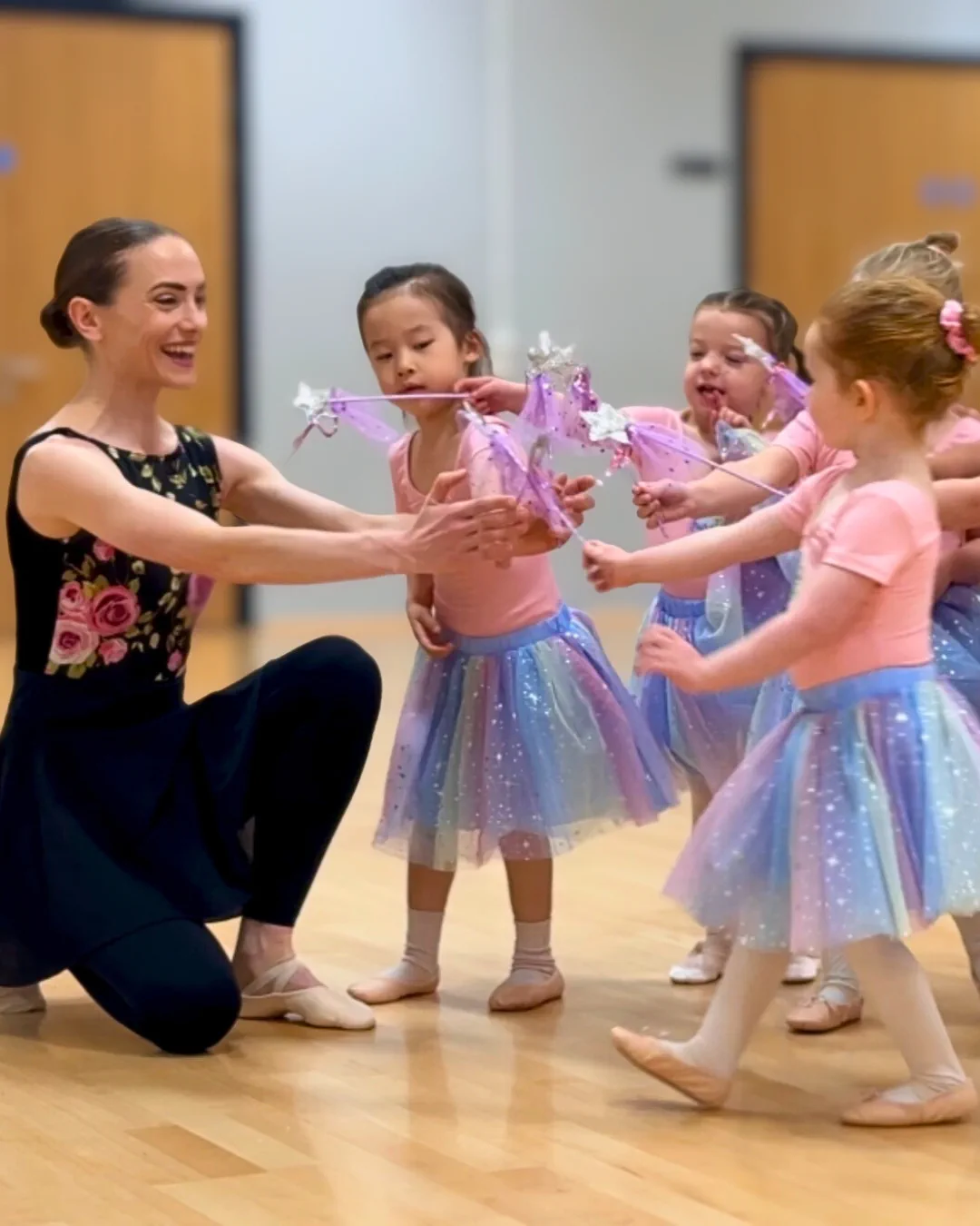 Fairytale Ballet® Ballerinas using their magic wands on ballet teacher.