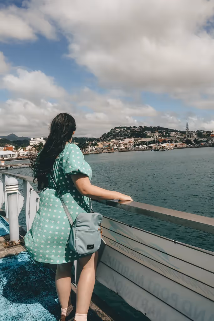 woman walking wearing saddle crossbody bag from pacsafe