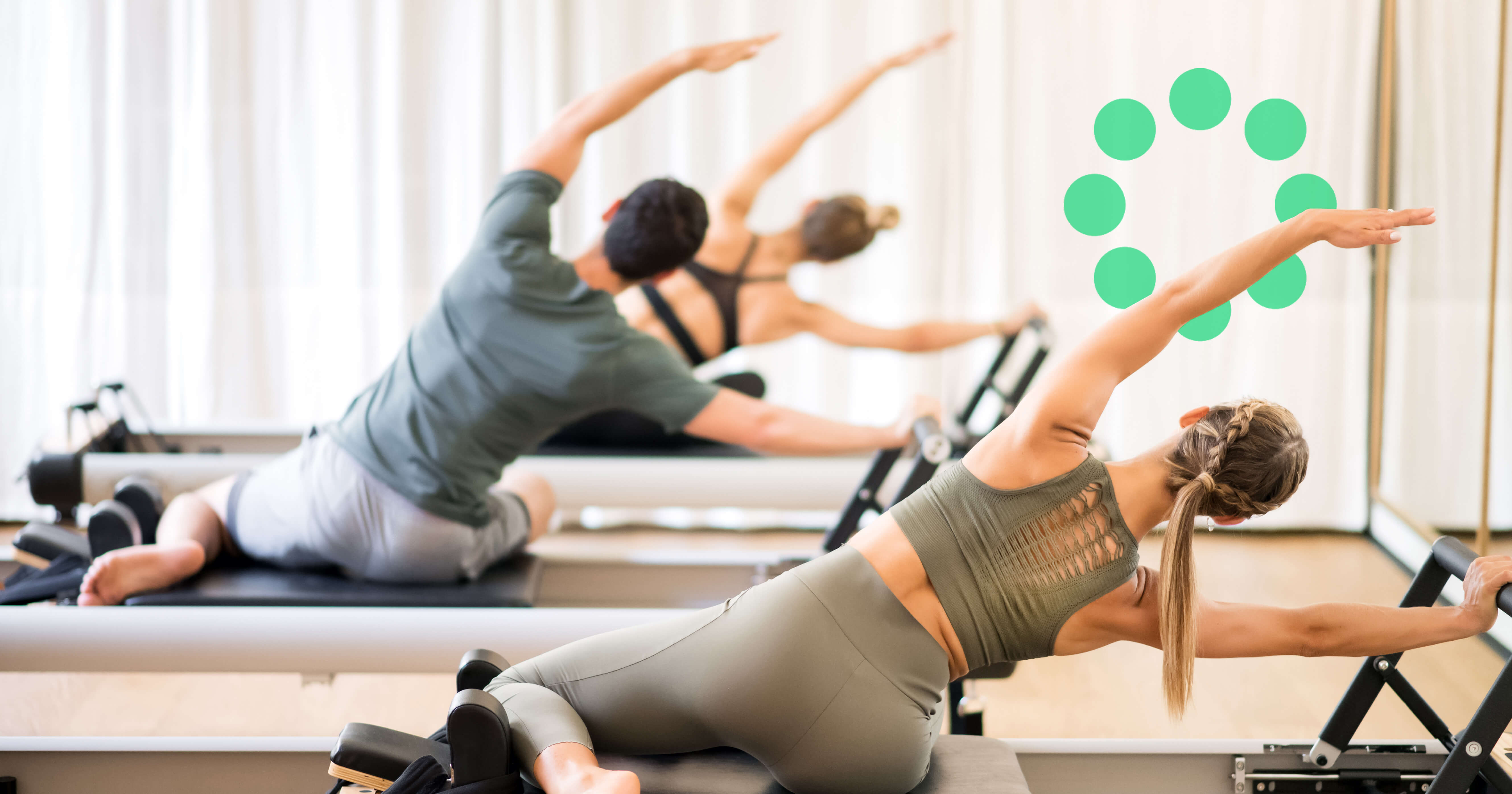 Pilates instructor taking group class