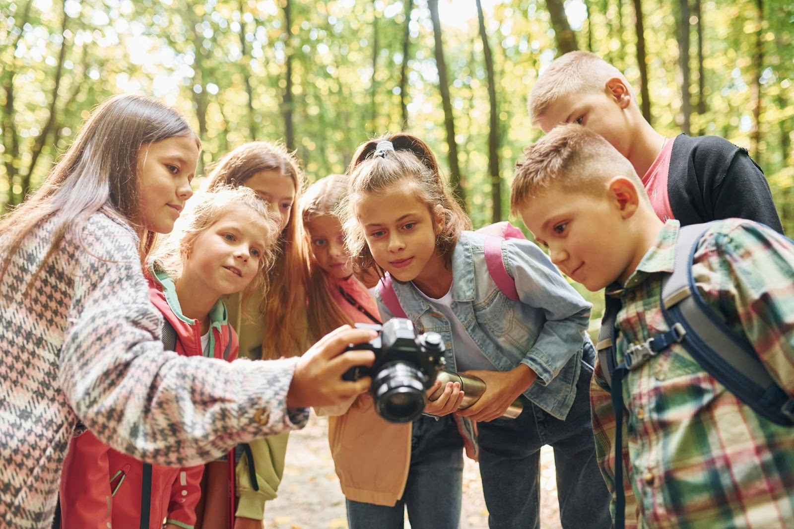 Kids taking pictures in the camp