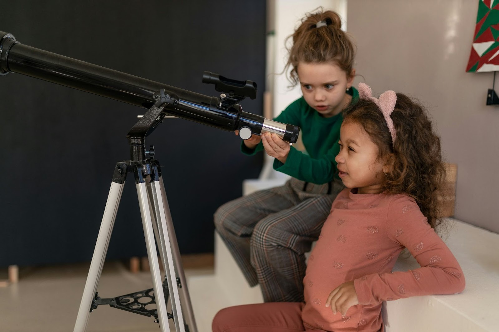 Kids observing the sky with telescope